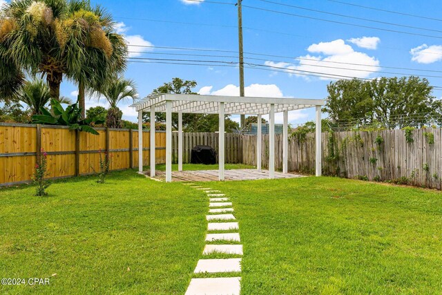 view of yard with a pergola and a patio area