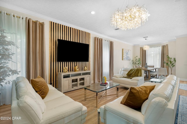 living room featuring ornamental molding, light hardwood / wood-style flooring, and a healthy amount of sunlight