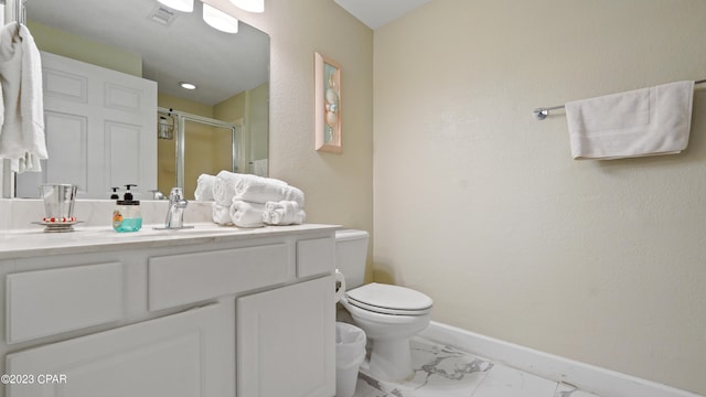 bathroom featuring vanity, toilet, and tile patterned floors