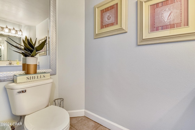 bathroom with tile patterned flooring and toilet