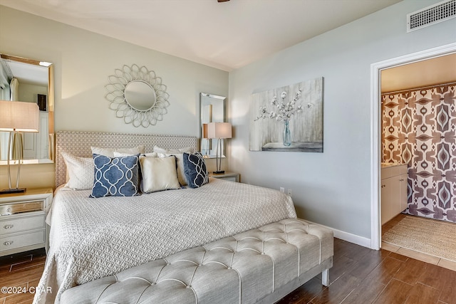 bedroom featuring connected bathroom