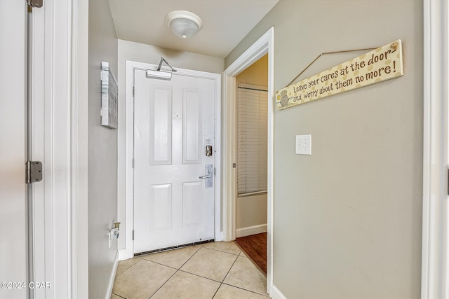 entryway featuring light tile patterned flooring