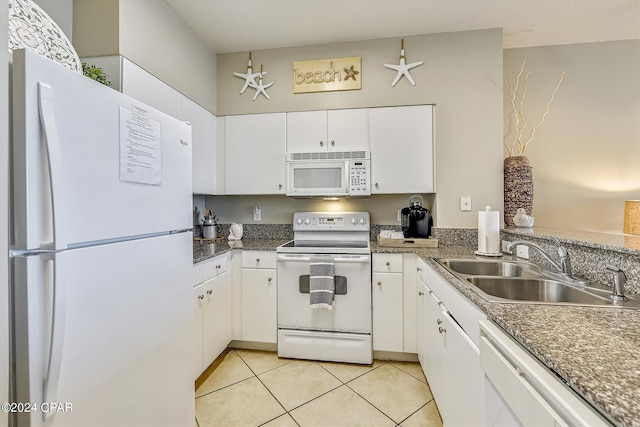 kitchen featuring white cabinetry, white appliances, sink, and light tile patterned floors