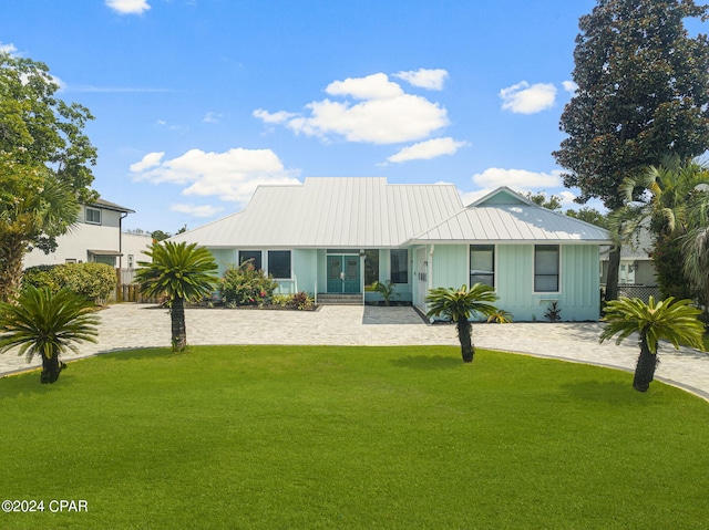 rear view of house with a lawn