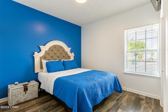 bedroom with wood-type flooring