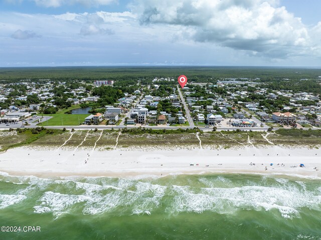 aerial view featuring a water view and a view of the beach