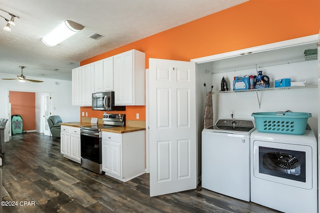 kitchen with stainless steel appliances, visible vents, dark wood-type flooring, washing machine and dryer, and white cabinetry