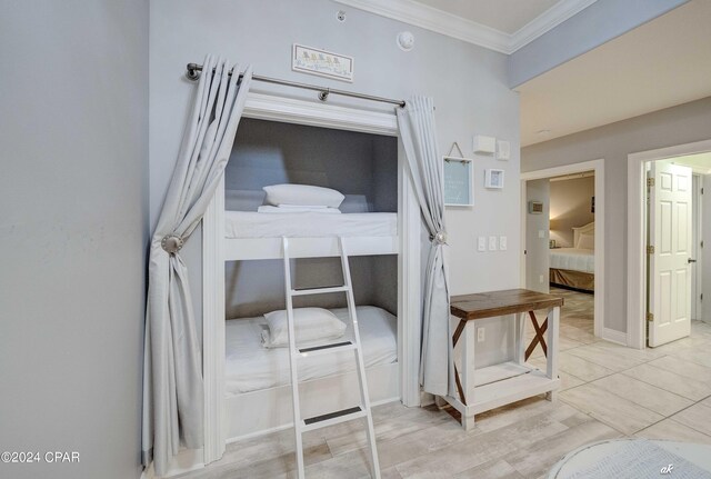 bedroom featuring ornamental molding and a closet