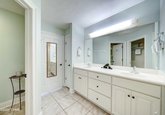 bathroom featuring tile patterned floors and vanity