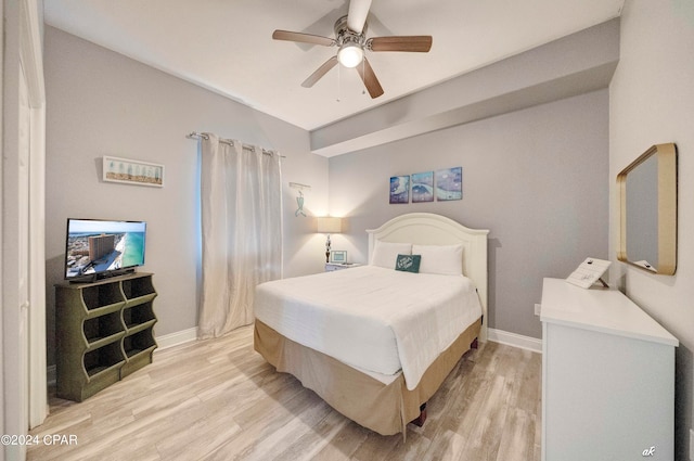 bedroom with ceiling fan and light wood-type flooring