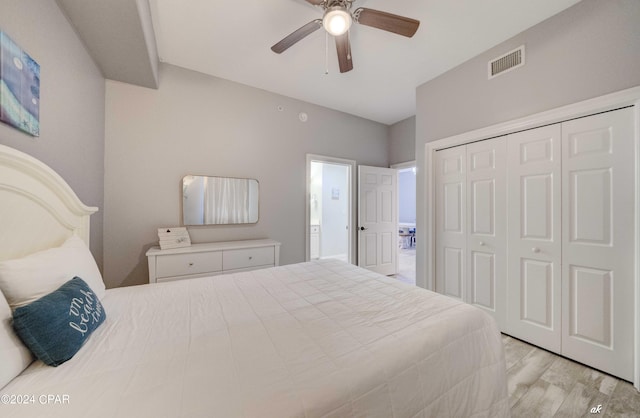 bedroom featuring light hardwood / wood-style floors, a closet, and ceiling fan