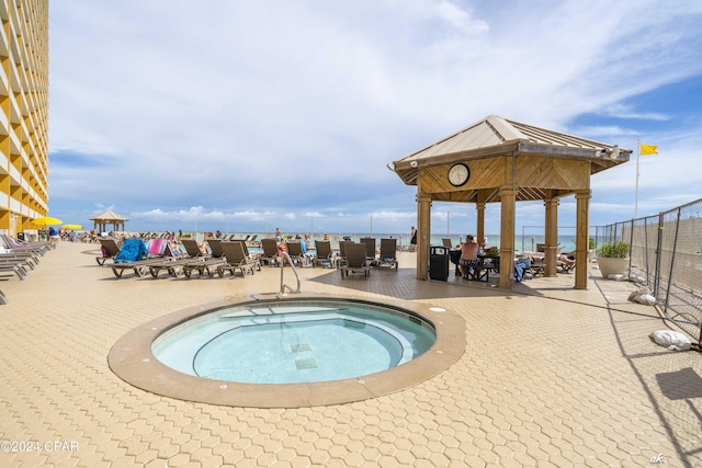 view of pool featuring a gazebo, a patio area, and a community hot tub