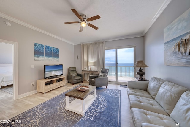 living room with hardwood / wood-style floors, crown molding, a textured ceiling, and ceiling fan