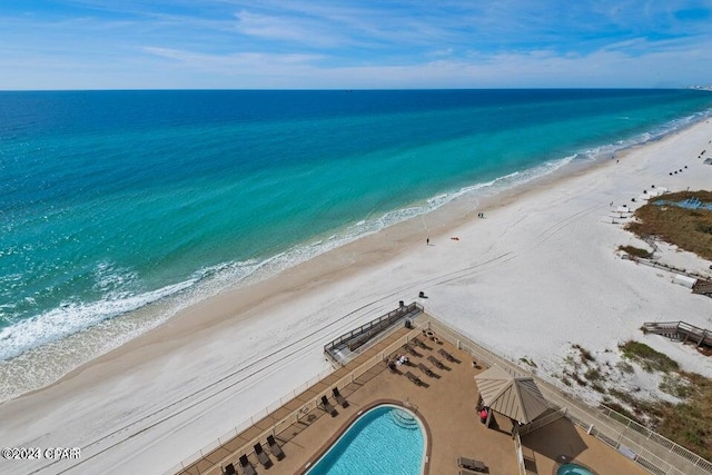 aerial view featuring a water view and a beach view