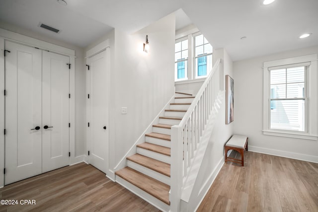 interior space with light hardwood / wood-style floors and plenty of natural light