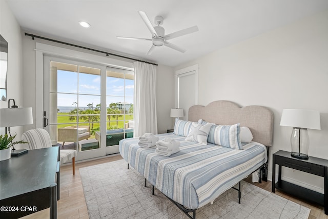 bedroom featuring light wood-type flooring, ceiling fan, and access to exterior