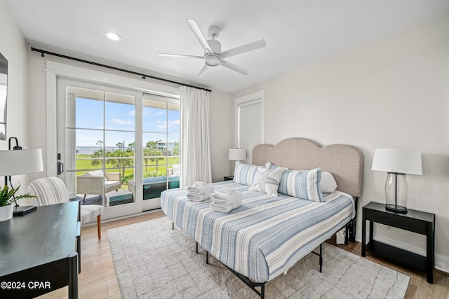 bedroom with access to exterior, light wood-type flooring, and ceiling fan