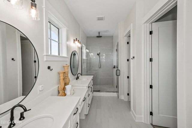 bathroom with vanity and an enclosed shower