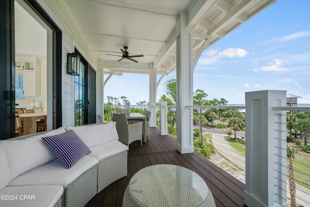 deck featuring ceiling fan and an outdoor hangout area