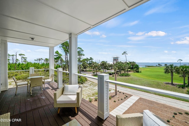 wooden terrace featuring a water view