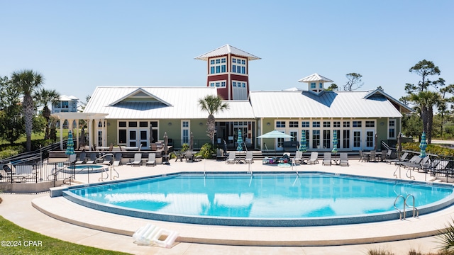 view of pool featuring a patio area and french doors