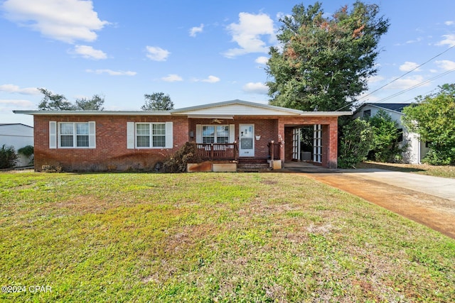 single story home featuring a front lawn