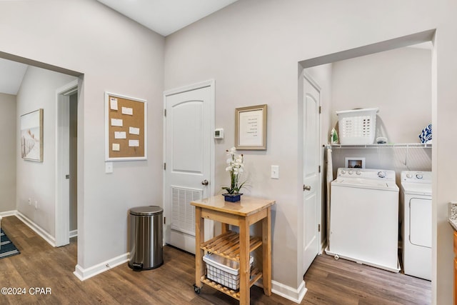 laundry room with dark wood-style floors, laundry area, visible vents, and washer and clothes dryer