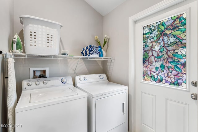 laundry room with laundry area and washing machine and clothes dryer