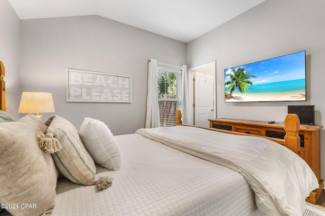 bedroom featuring lofted ceiling