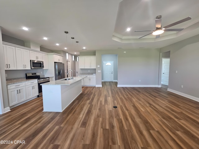 kitchen featuring appliances with stainless steel finishes, dark hardwood / wood-style floors, and white cabinetry