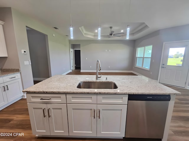 kitchen with white cabinets, a raised ceiling, sink, stainless steel dishwasher, and ceiling fan