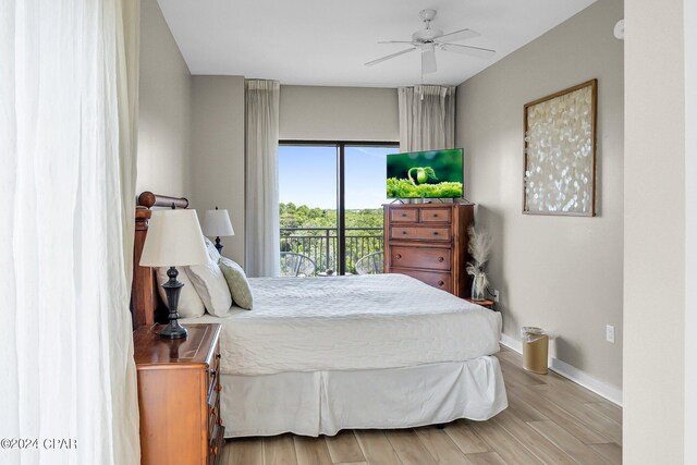 bedroom with light hardwood / wood-style floors, access to exterior, and ceiling fan