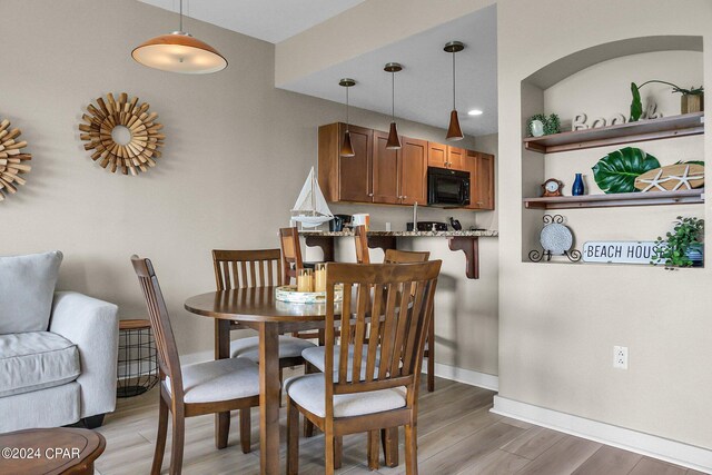 dining room with light wood-type flooring