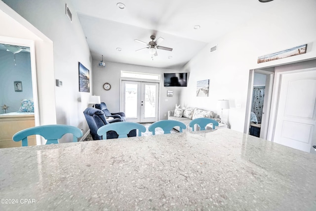 interior space featuring french doors, ceiling fan, and lofted ceiling