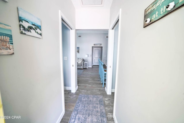 corridor featuring dark hardwood / wood-style floors