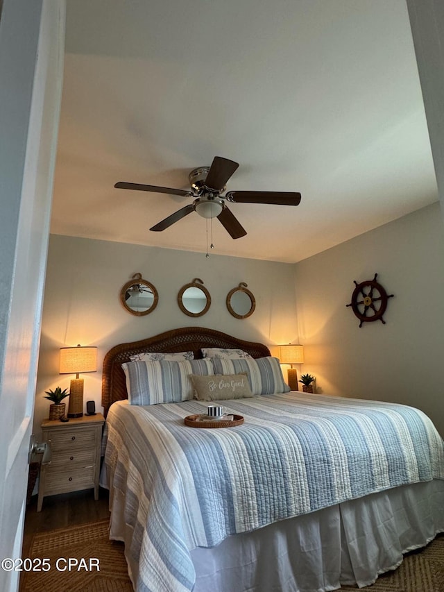 bedroom with wood finished floors and ceiling fan