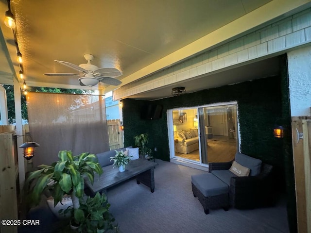 view of patio with a ceiling fan and fence