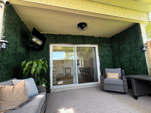 view of patio featuring ceiling fan