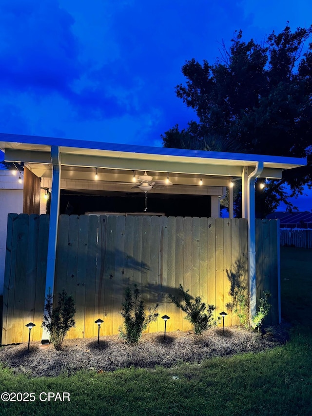 view of outbuilding with fence