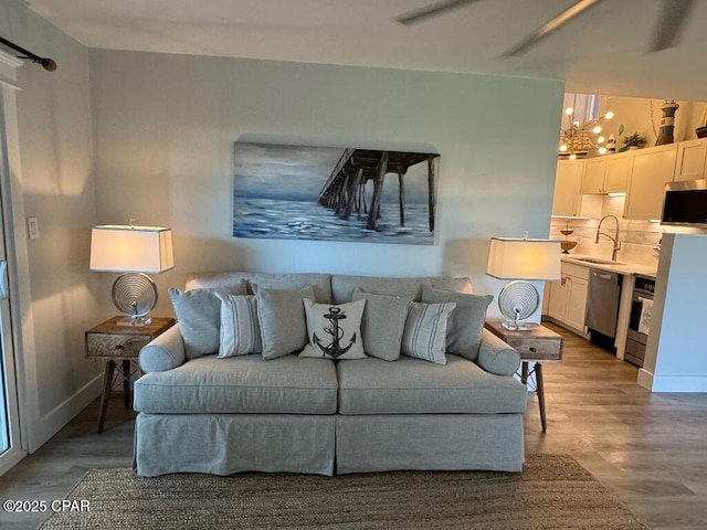 living room featuring baseboards and wood finished floors