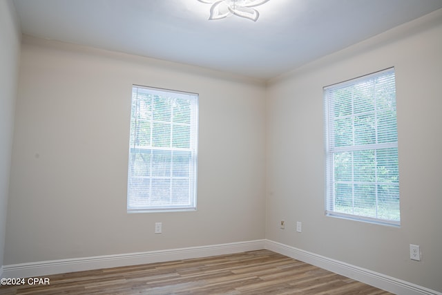 unfurnished room featuring hardwood / wood-style floors