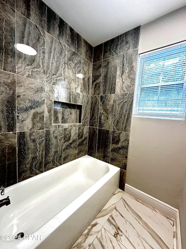 bathroom featuring tiled shower / bath combo