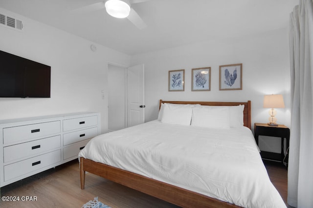 bedroom featuring dark hardwood / wood-style flooring and ceiling fan