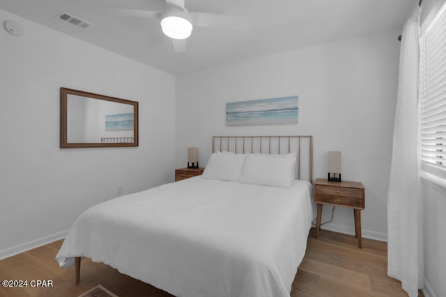 bedroom with light wood-type flooring and ceiling fan