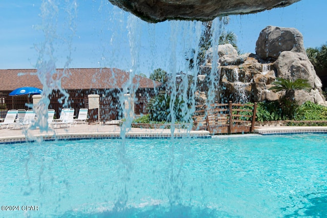 view of pool featuring pool water feature