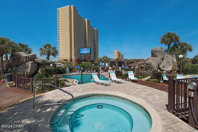 view of pool featuring a hot tub