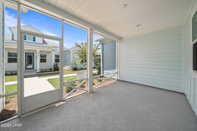 unfurnished sunroom featuring plenty of natural light