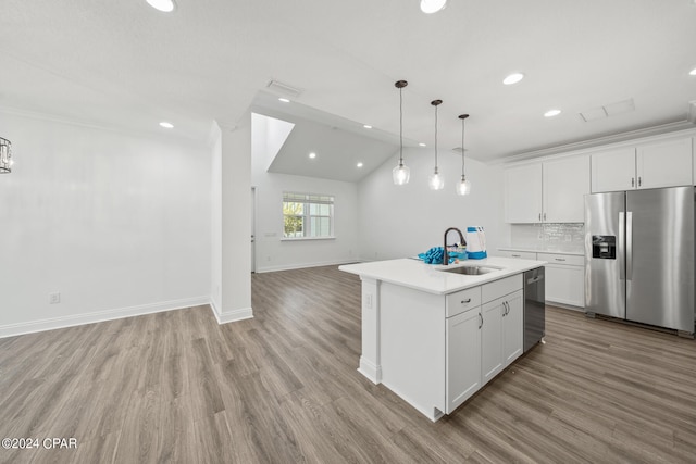 kitchen with light hardwood / wood-style flooring, stainless steel appliances, vaulted ceiling, white cabinets, and sink