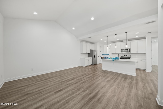 unfurnished living room featuring light hardwood / wood-style floors and lofted ceiling