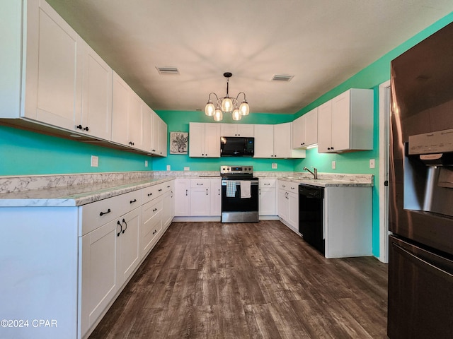 kitchen with white cabinetry, sink, black appliances, hanging light fixtures, and dark wood-type flooring